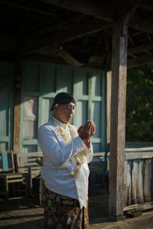 the woman is offering pray to people on the boardwalk