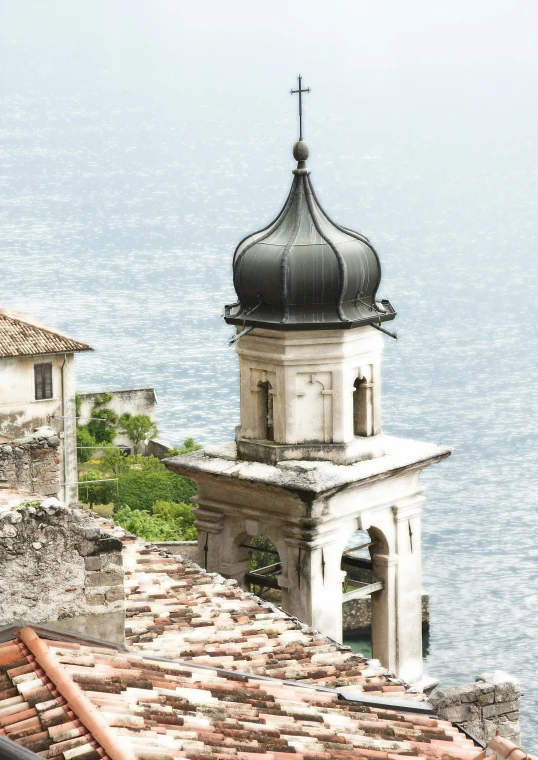 the view from a balcony of an old building looking over the water