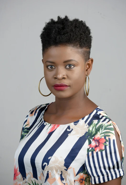 a woman posing for a picture with an afro hairstyle