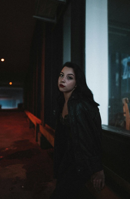 a woman is standing next to a car