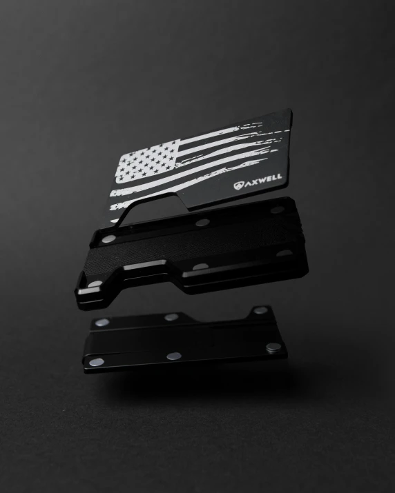 a thin metal wallet has an american flag design on it