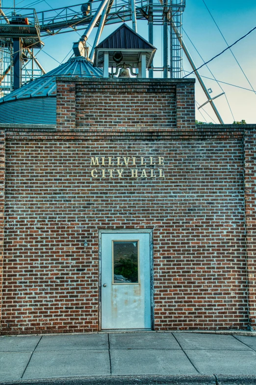 a very large brick building with the words green light in the window