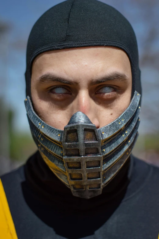 a man with a mask made of metal and cloth