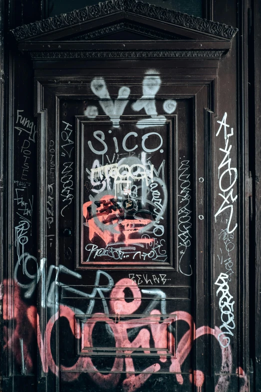 the door to a building has been covered with graffiti