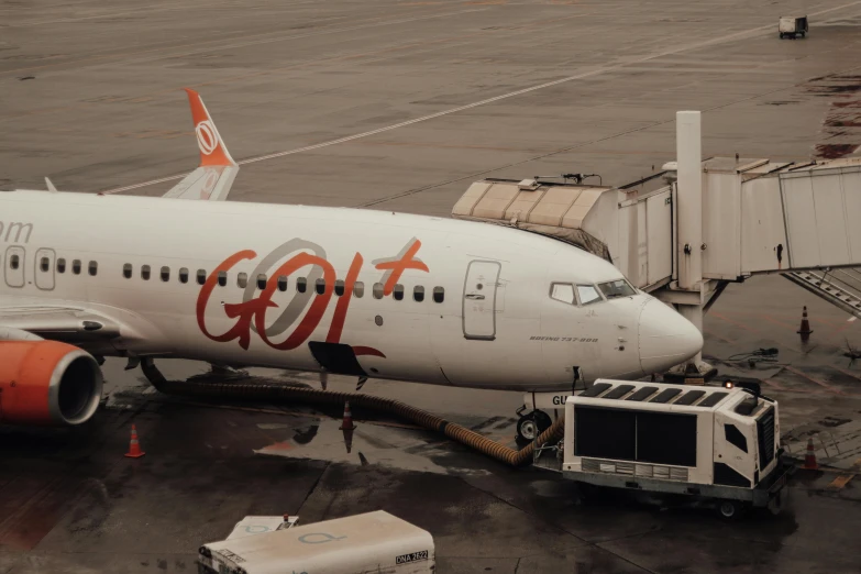 a big plane being loaded by a truck