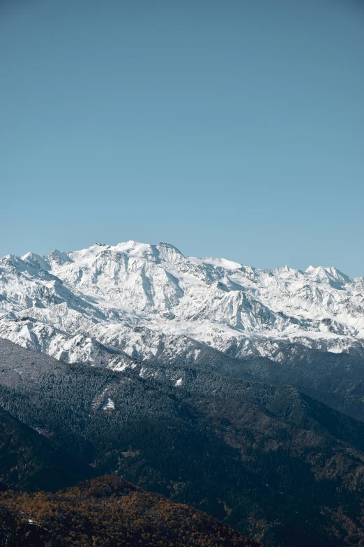 the snowy mountain range is covered with mountains