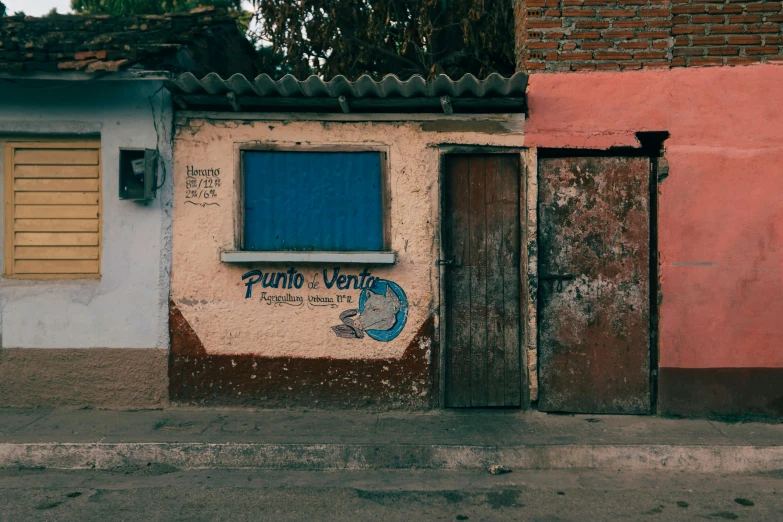 a building with a door to another house and some windows