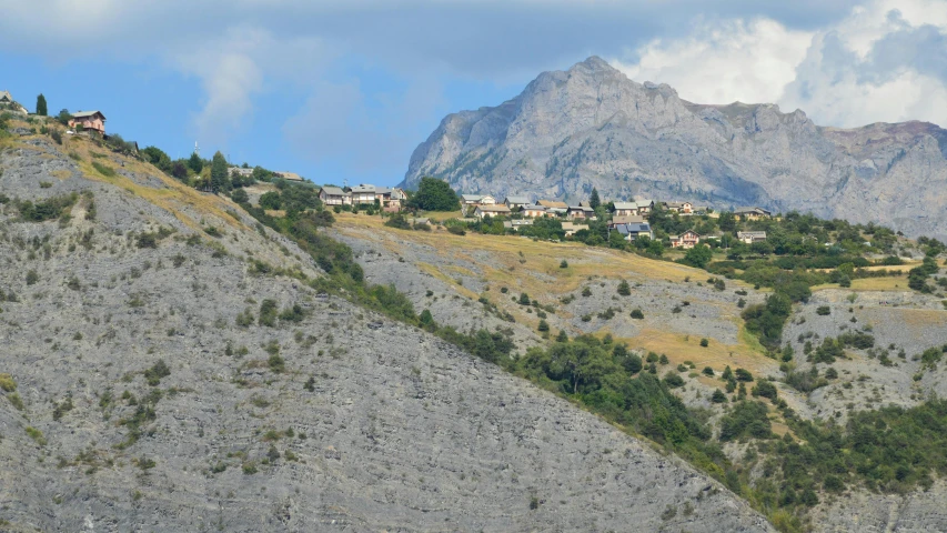 a hillside with a hill village nestled between it