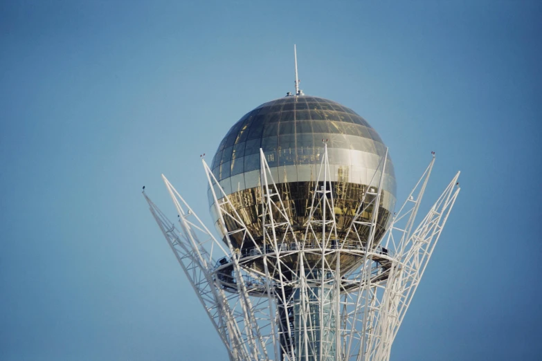 a large glass structure in the middle of the sky