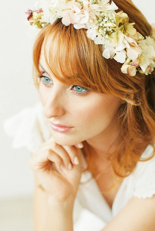 woman with flower in her hair wearing a headband