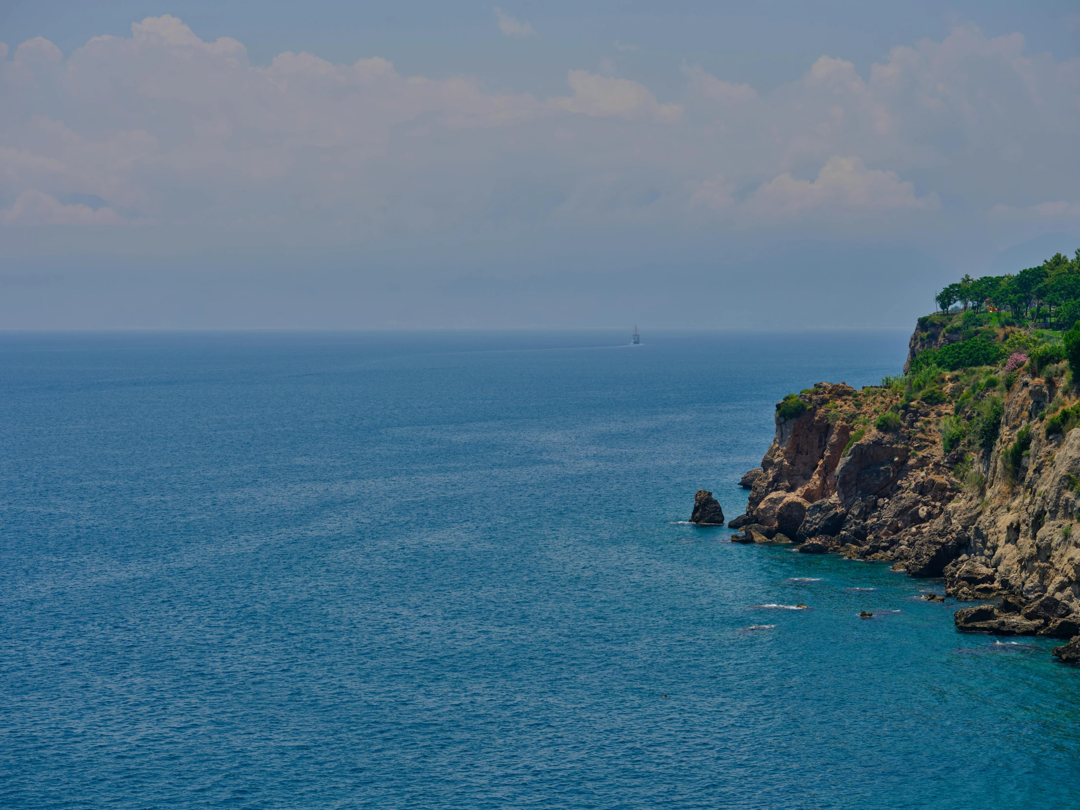 an ocean with people on rafts out in the water