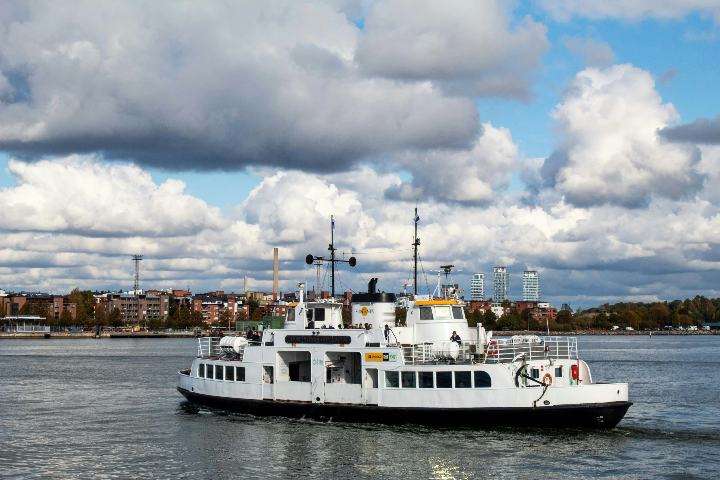 a large white boat out on the water