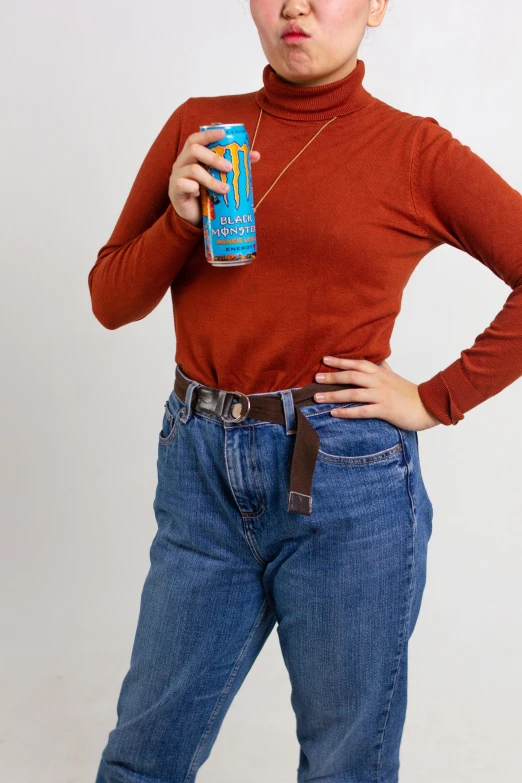 the woman is posing with her drink and looking at the camera