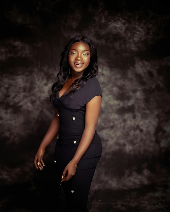 a woman posing for the camera in a black dress