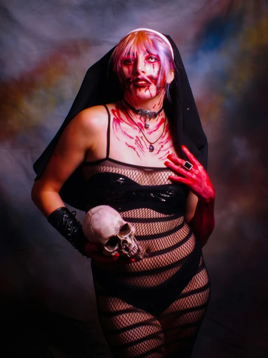 a woman with makeup holding a skull in her hand