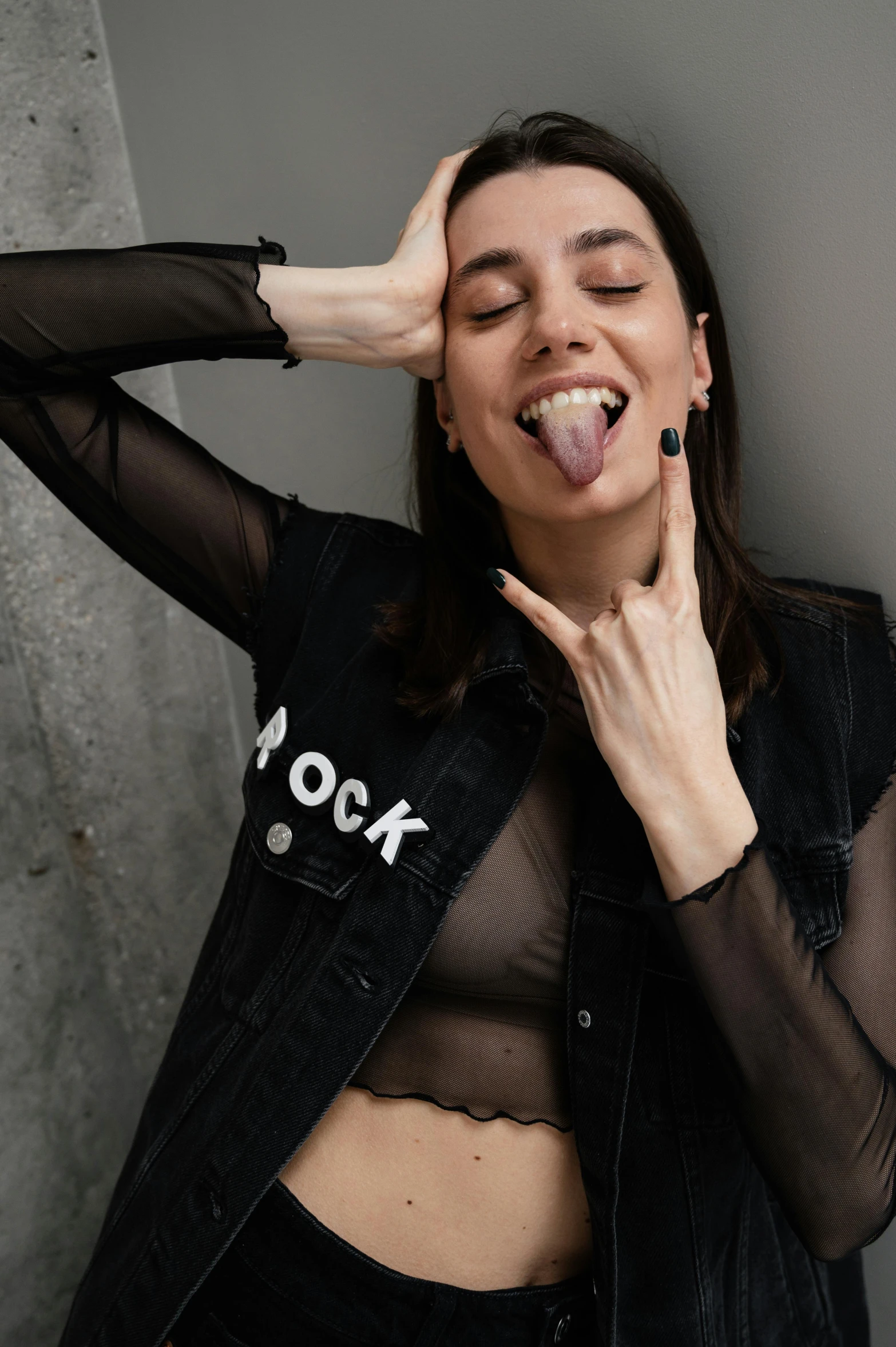 a woman posing for a po with her tongue out