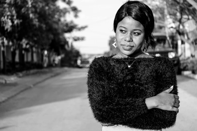 a women that is standing up with her arms crossed