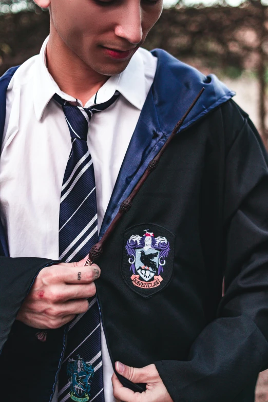 a man wearing an official harry potter tie