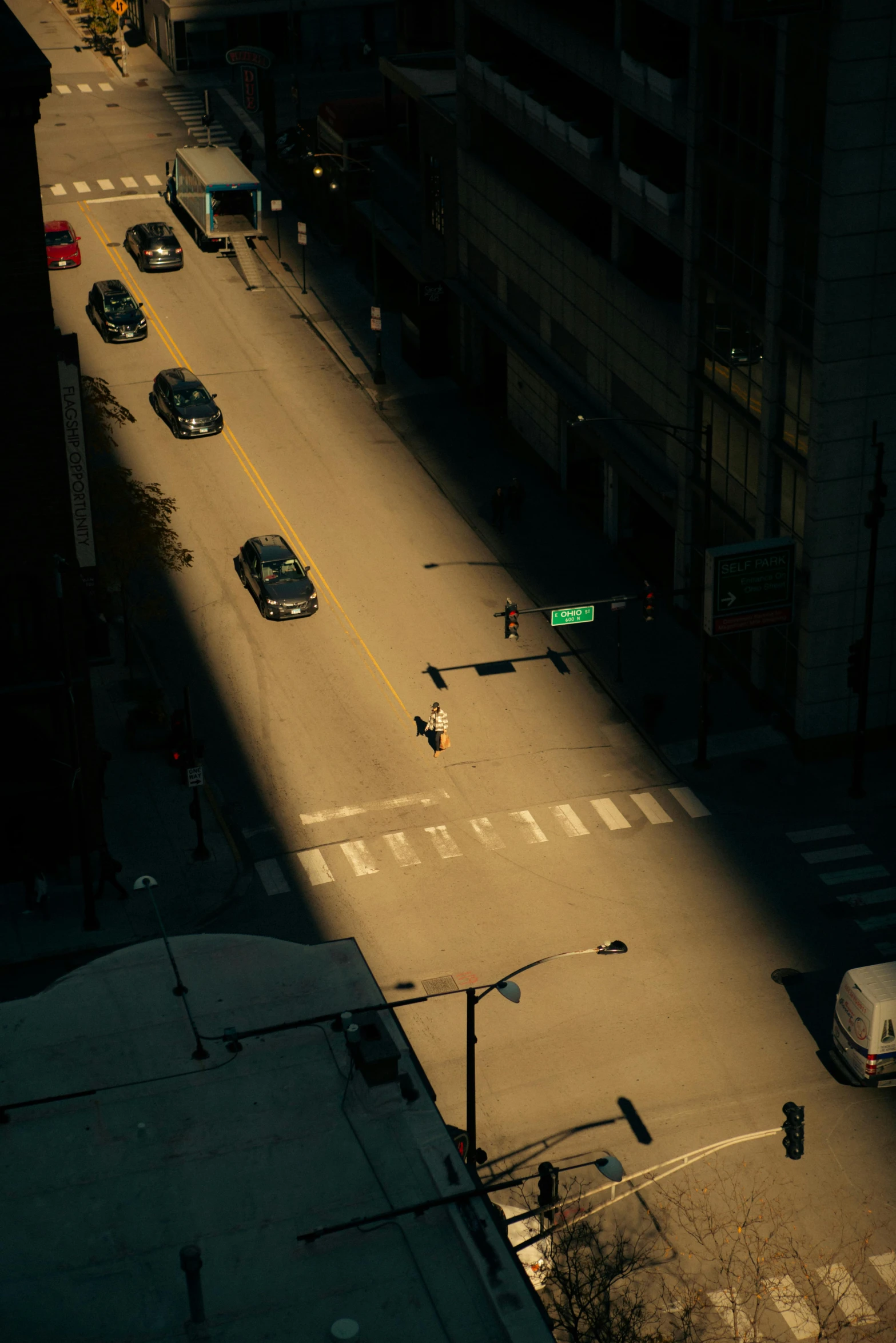 traffic on a road, in the middle of a city