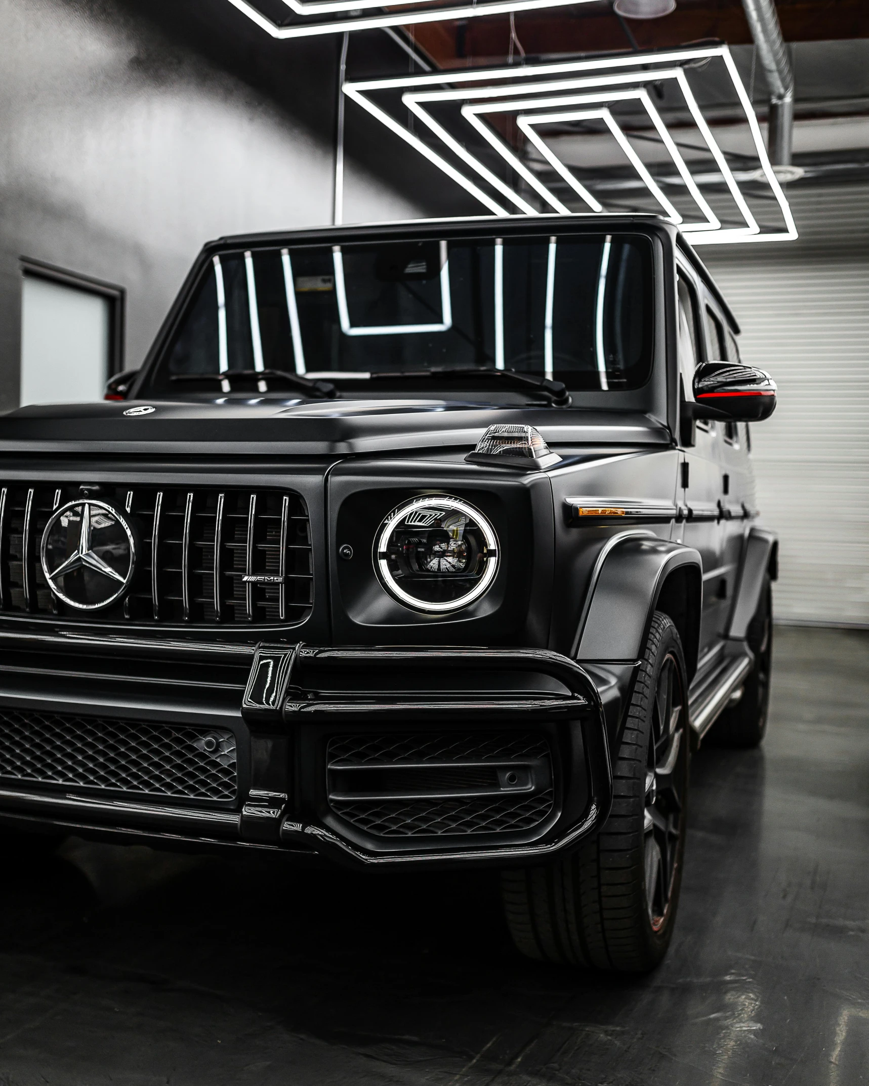 a jeep that is parked inside of a garage