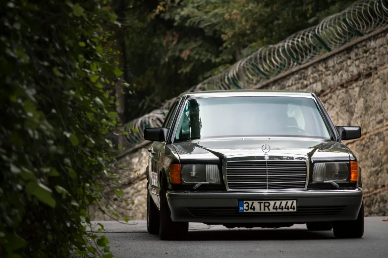 a mercedes benz is seen on the road