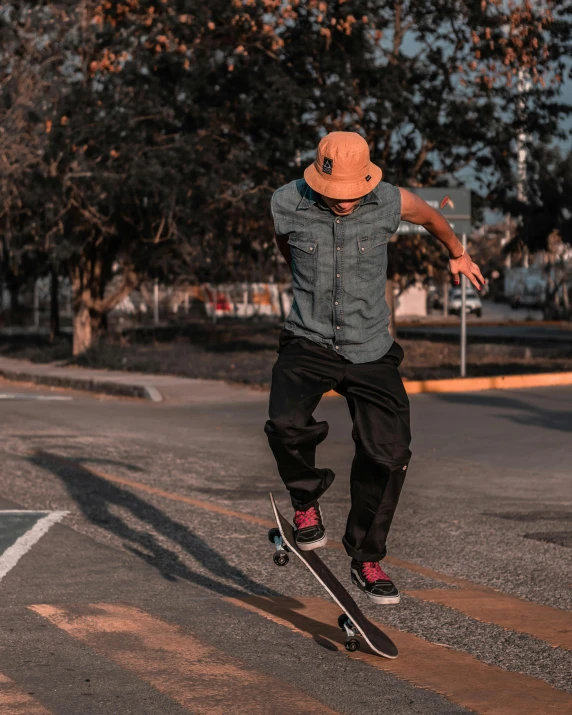 a man in a hat is jumping with his skateboard