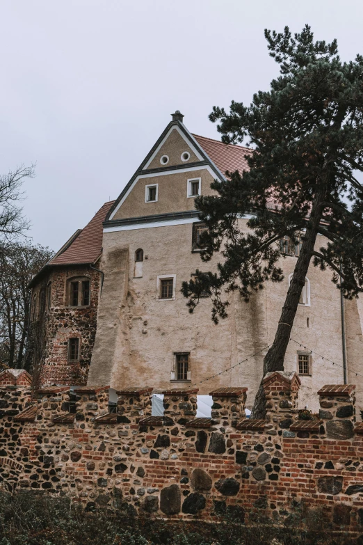 a large building is next to a brick wall