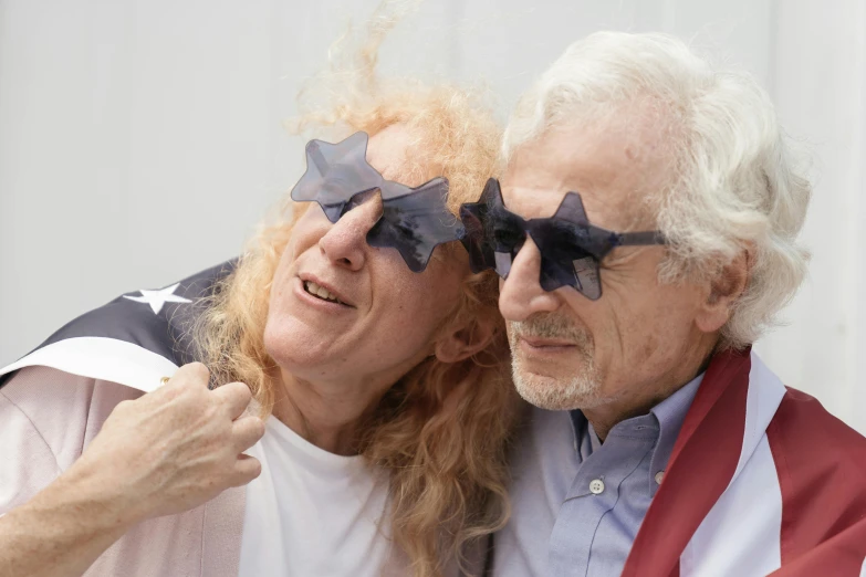 two people taking a selfie with sunglasses on