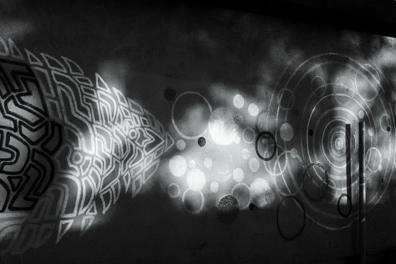 the wall with black and white pograph of some circles