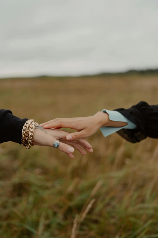 two people reaching out their hands to each other