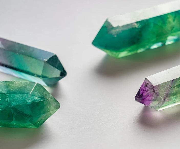 three stones sitting on top of a table