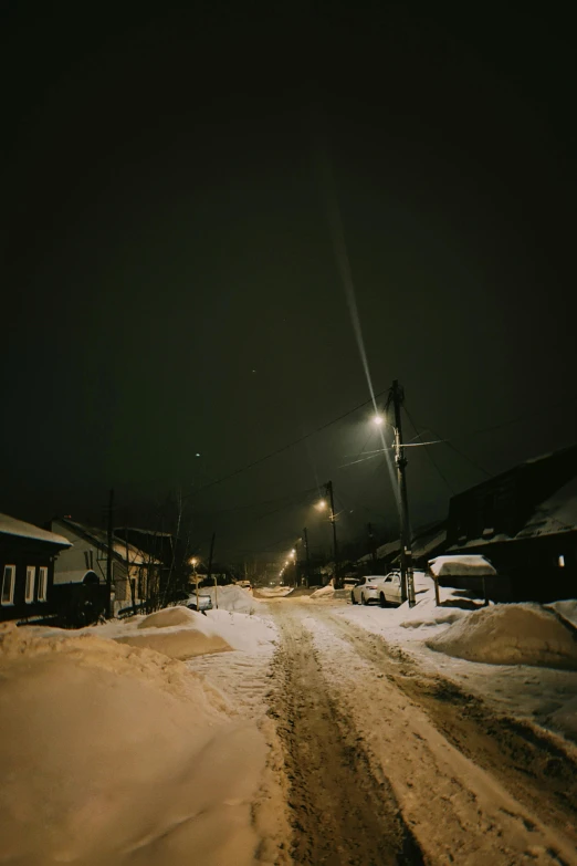 a city street is covered in deep snow