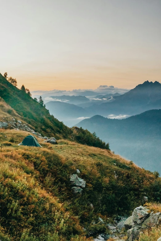 two tents set up on top of a mountain