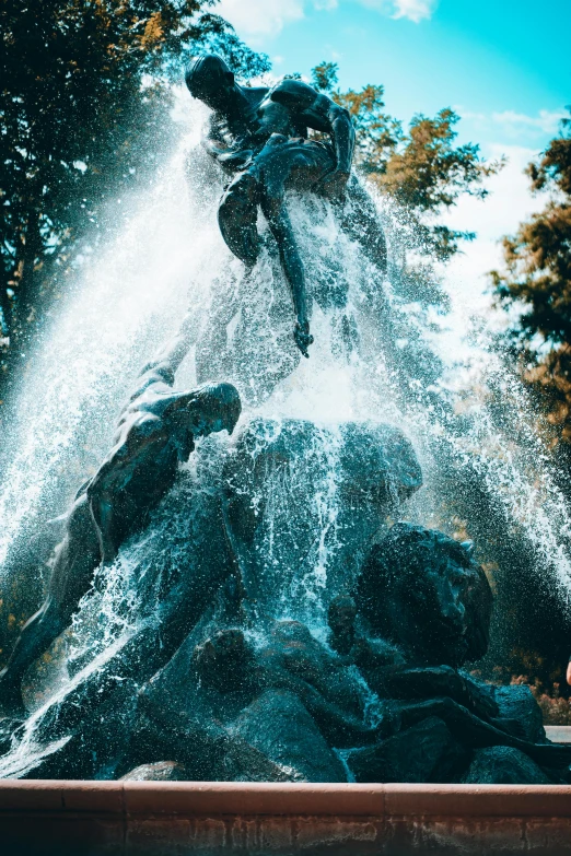 a very large water sculpture with a man riding on it