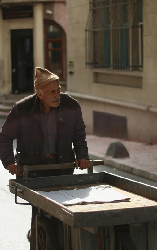 a man standing next to a garbage can