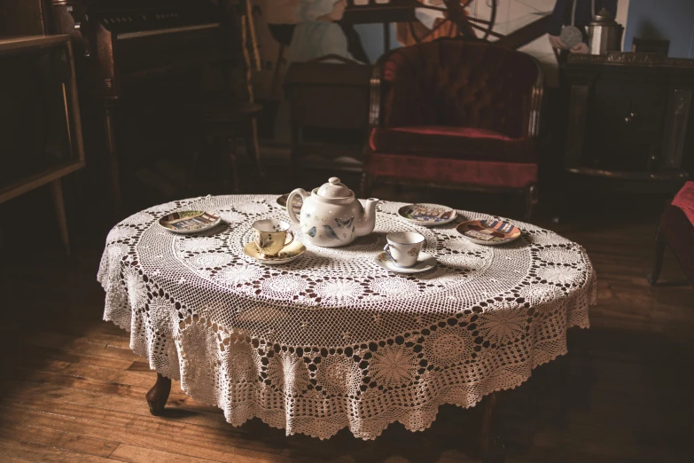 an old fashioned round table has some dishes on it