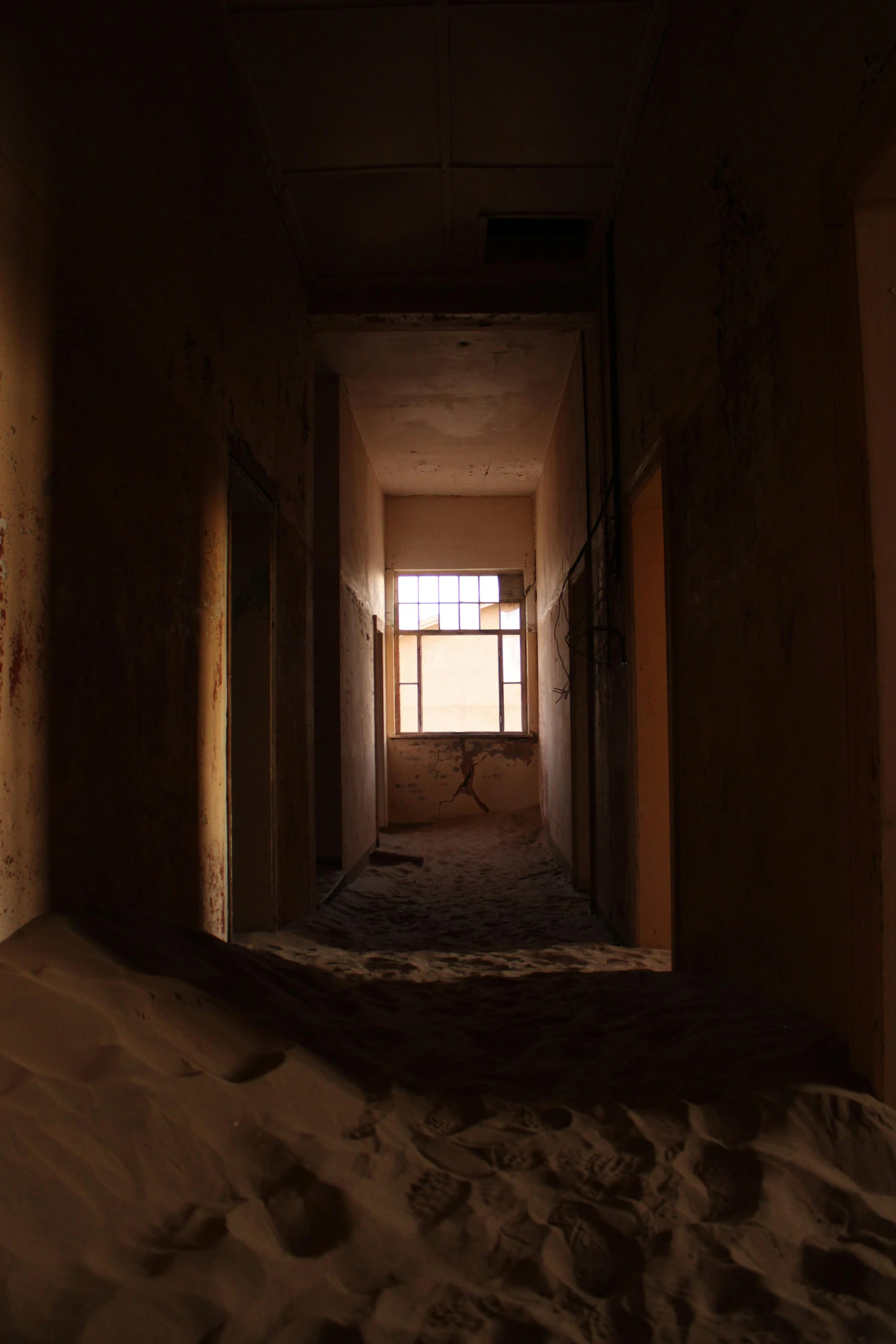 light is shining from an open window in a hallway