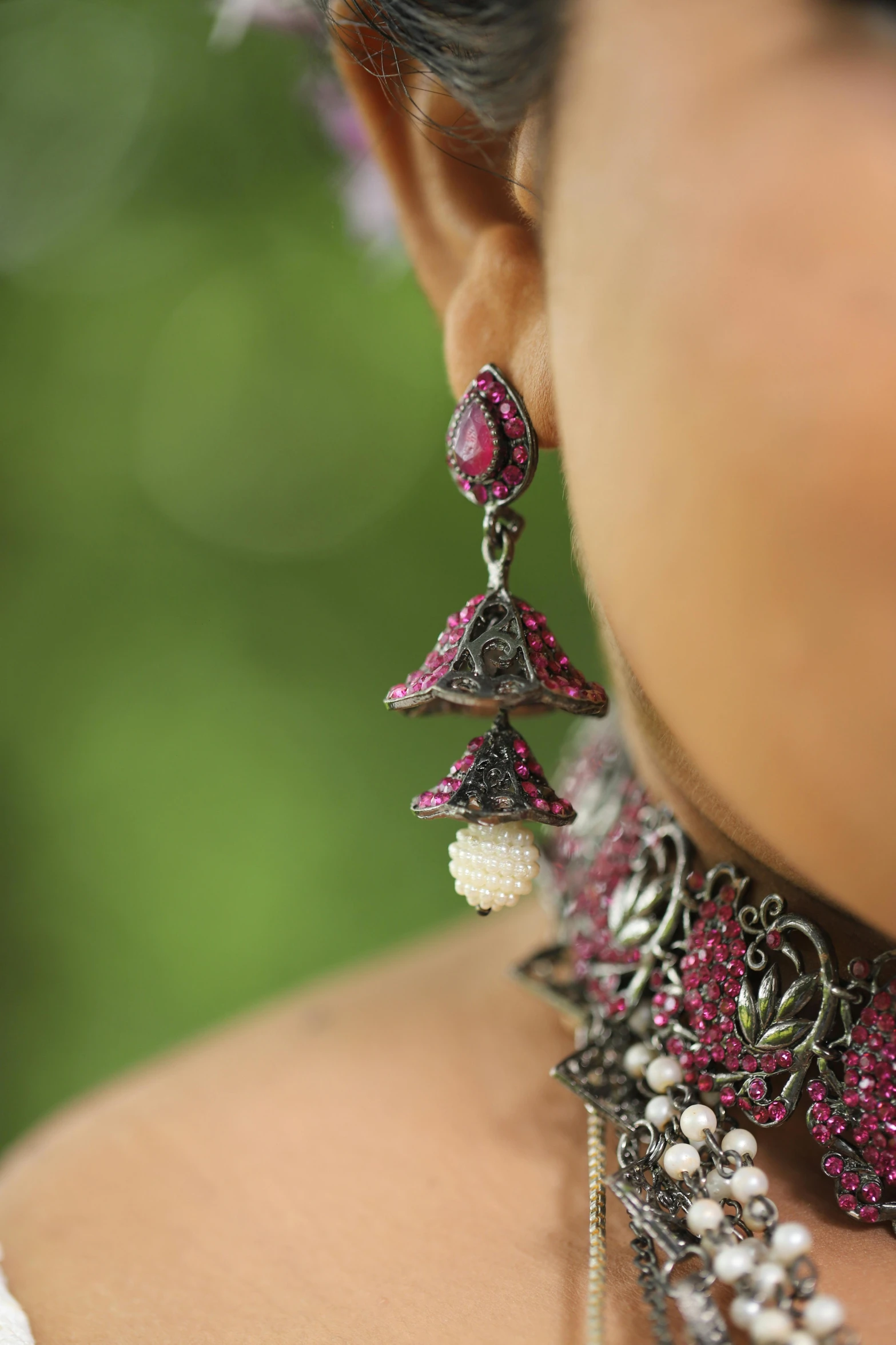 close up of a necklace with different jeweled designs