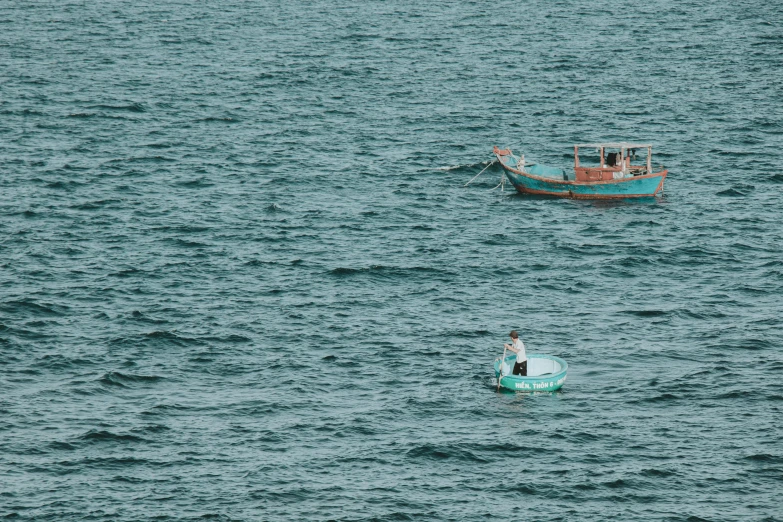 two boats that are sitting in the water