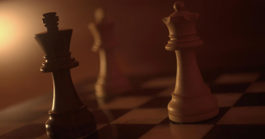 a po of chess pieces sitting on the side of a chess board