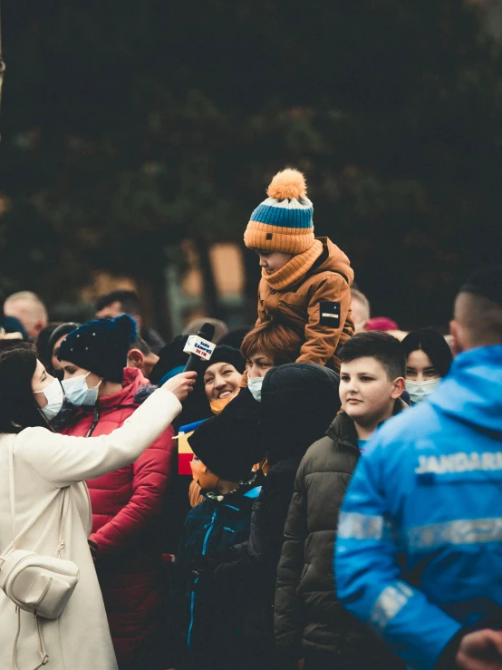 several people with masks are standing together