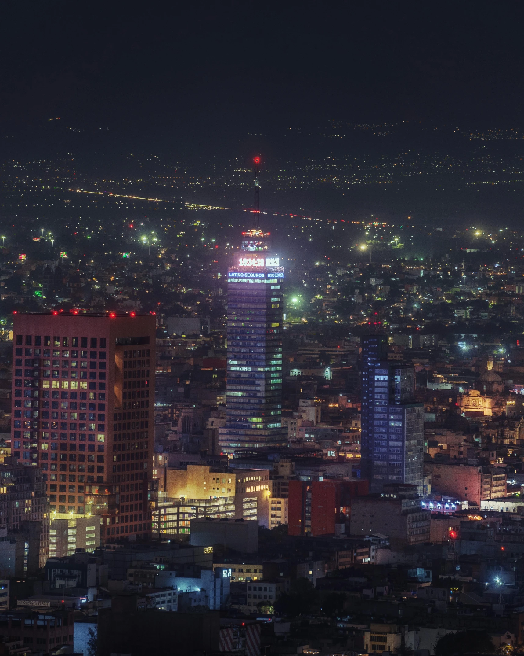 a city view at night is lit up with bright lights