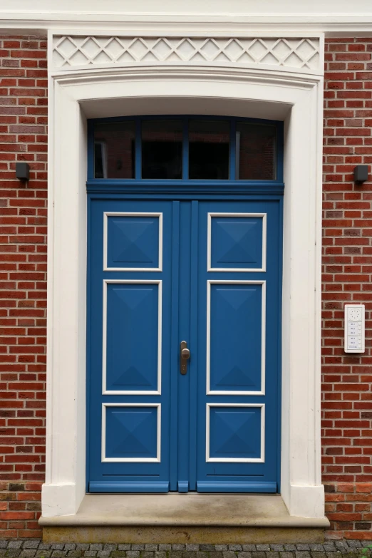 an open door of a large brick building