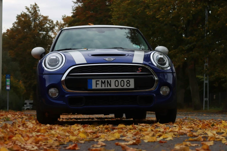 a blue and white car on the side of a street