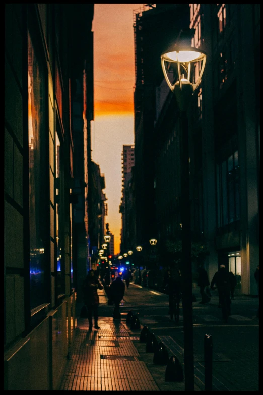 a picture of people walking along an urban street