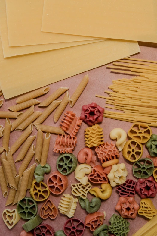 several different pasta and other things on a table