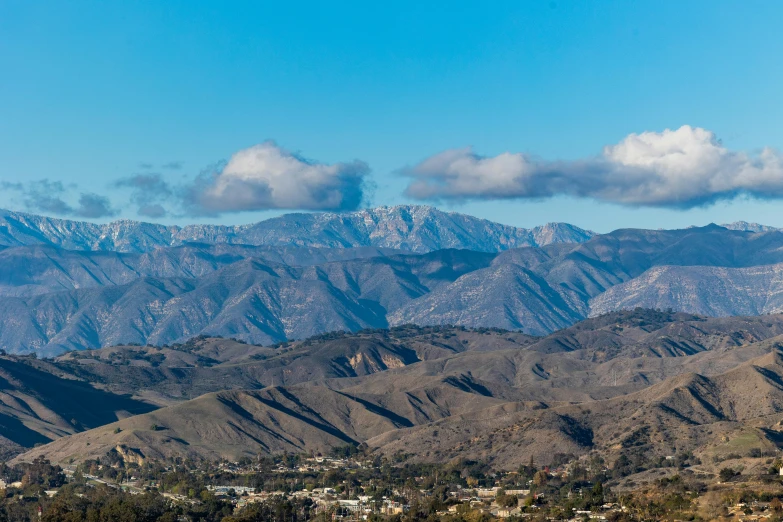 mountains covered with snow under a blue sky