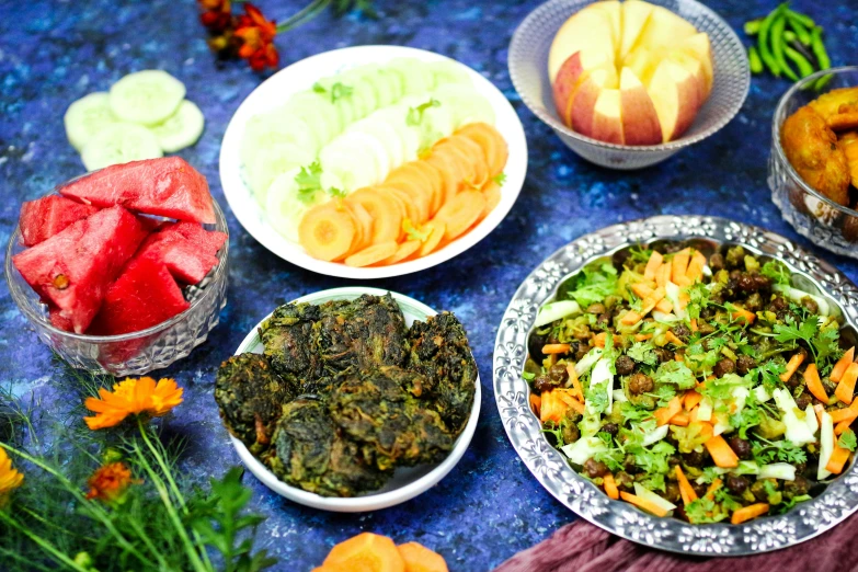 an assortment of food items arranged in various dishes