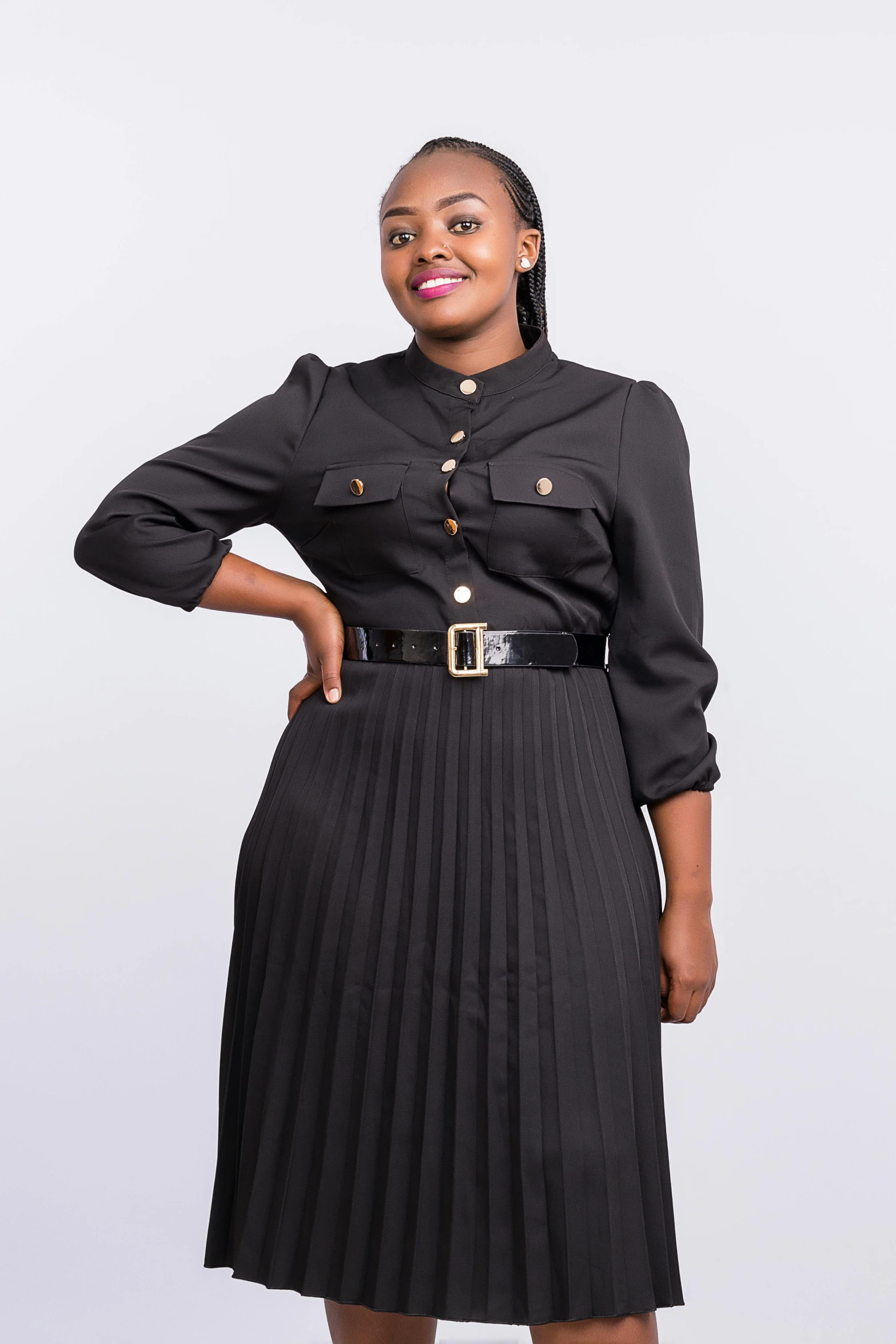 a woman standing in front of a white background