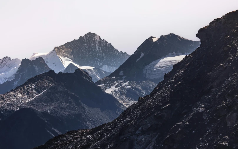 mountaintops, with large summits, on a cloudy day